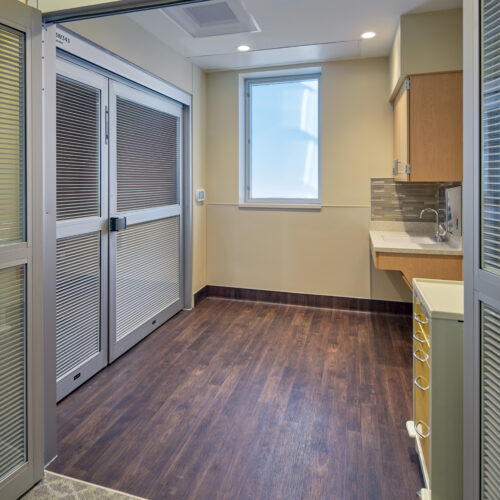 View of NICU room doubling as a nursing station and alternate private room.