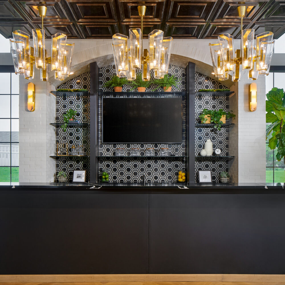 black high-top bar with gold chandeliers